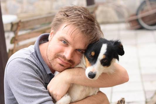 Man holding dogs